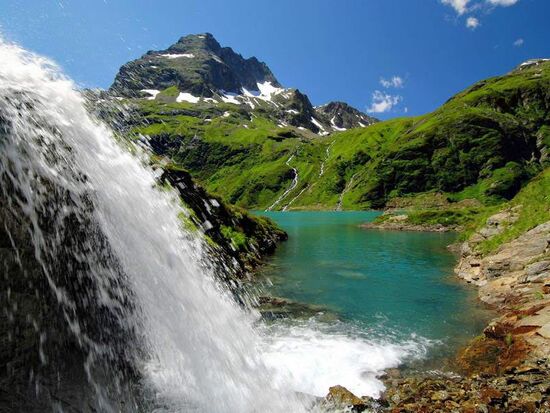 Clear mountain lake waterfall