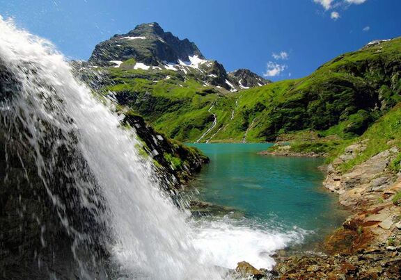 Clear mountain lake waterfall